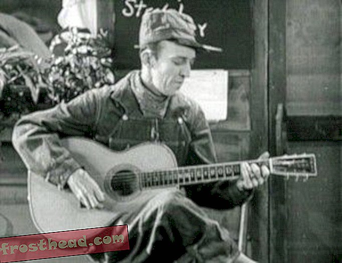 Jimmie Rodgers singt "Warten auf einen Zug" in The Singing Brakeman.