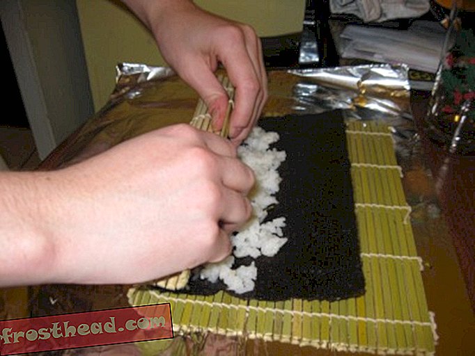 Rolling the first sushi.